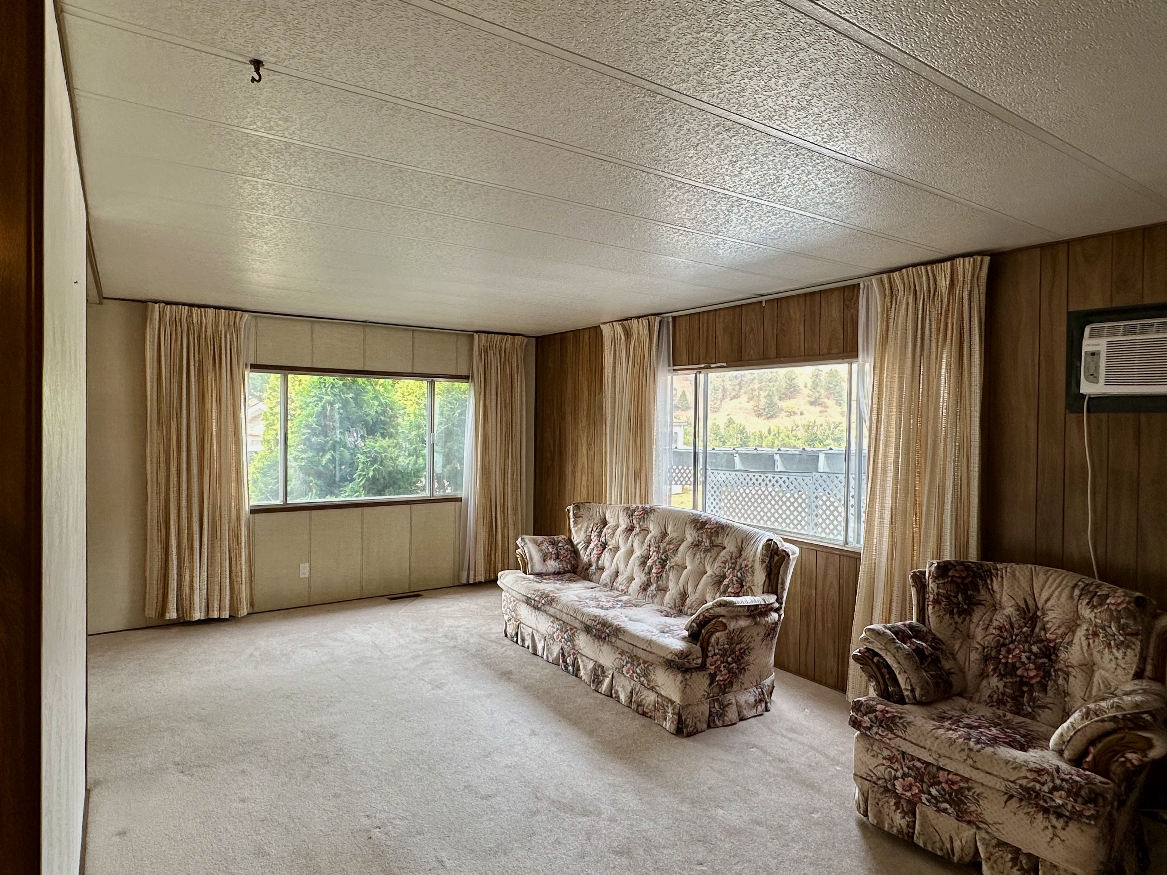 Spacious living room with large windows
